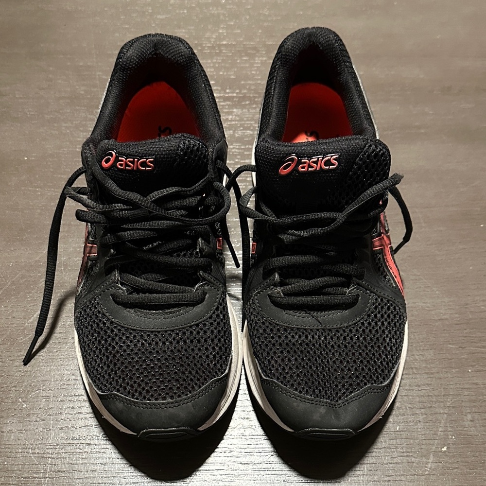 ASICS woman’s sneakers in black and orange, size 9